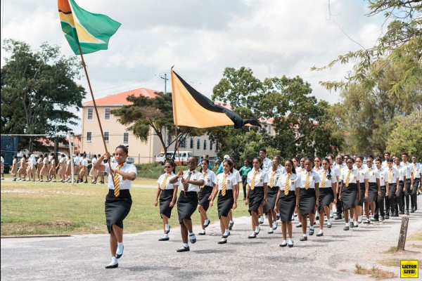 Alyssa Nurse (holding first flag) and her high school class in Guyana for a Remembrance Day Ceremony. Alyssa Nurse and her high school class in Guyana for a Remembrance Day Ceremony.