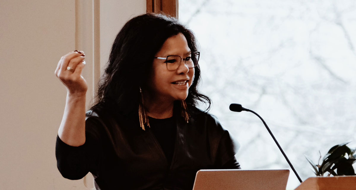 Dr. Jacqueline Ottmann, president of the First Nations University of Canada, delivered a keynote on the roles Indigenous and non-Indigenous peoples must play in reconciliation. She emphasized that Indigenization, led by Indigenous peoples, is a healing force while reconciliation requires collective responsibility to confront divisive policies.