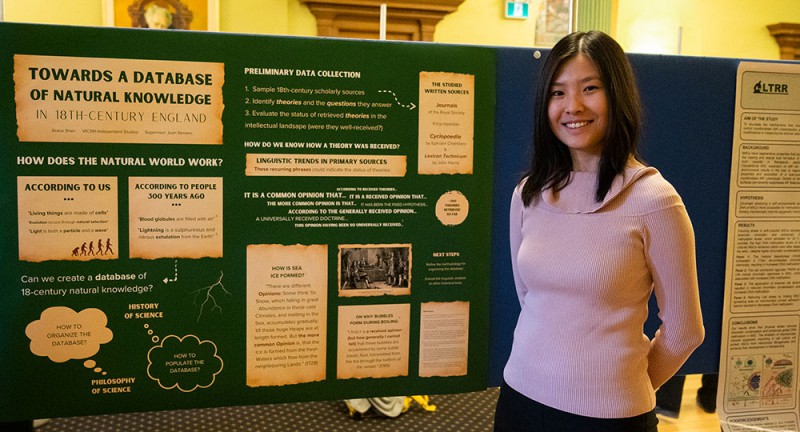 Grace Shan stands in Old Vic in front of a poster displaying her research. Grace Shan stands in Old Vic in front of a poster displaying her research.