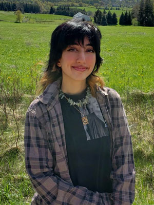 Mina Ali standing in a field. 