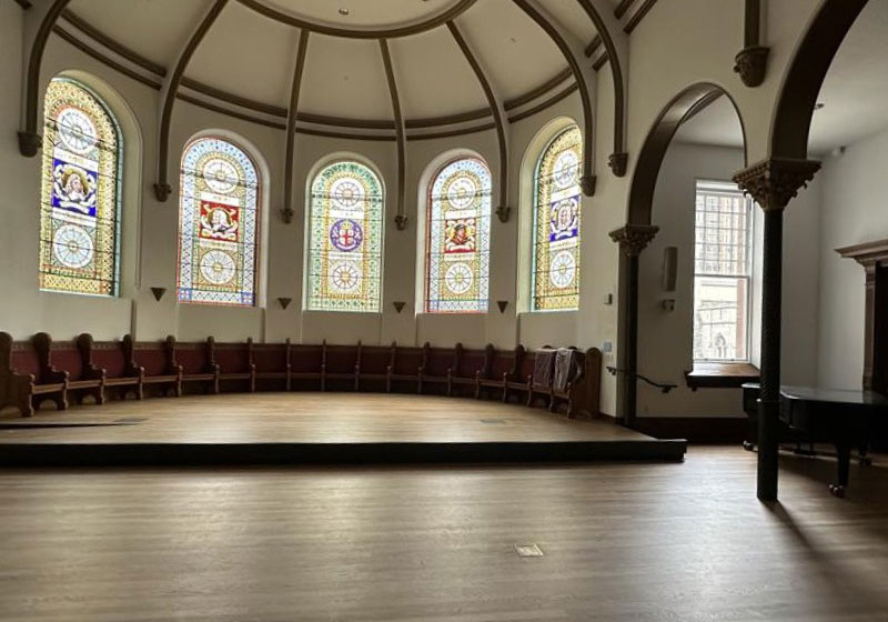 The historic Victoria College Chapel, built in 1892, has been transformed into a modern multipurpose space through an extensive renovation that preserved its heritage character while improving accessibility, acoustics and flexibility for a wider range of events.
